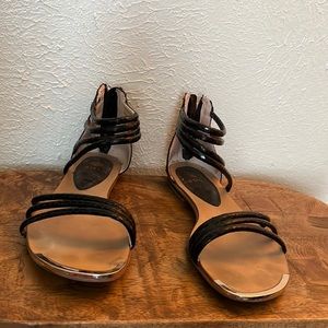 Black straps flats sandals.